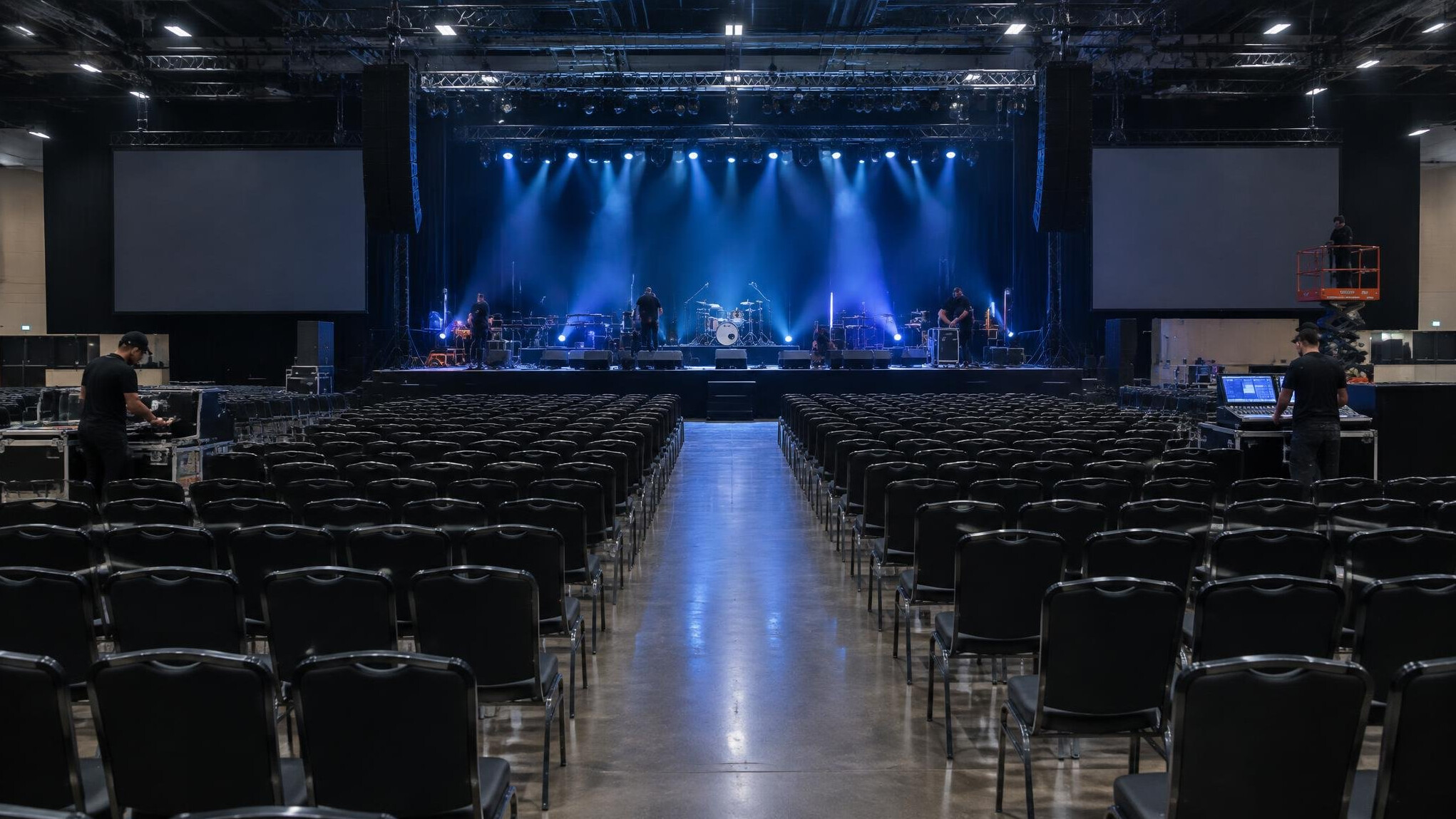 Event hall with organised seating and stage crew setup