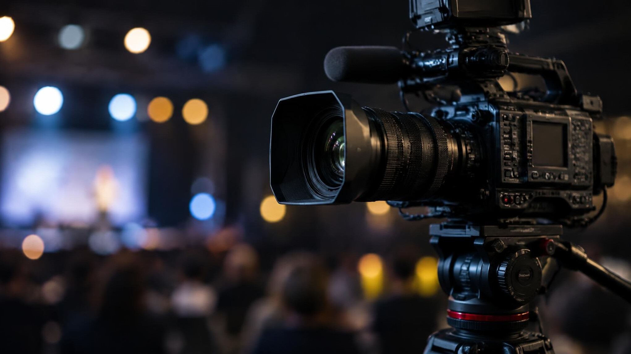Professional camera with lens on a tripod