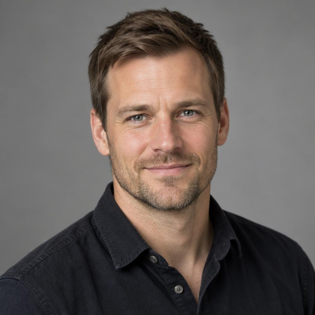 Portrait of a man with short hair smiling